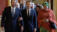 Le président Emmanuel Macron accueille le Premier ministre libanais Saad Hariri (g) et la vice-secrétaire générale de l'ONU Amina Mohammed, le 8 décembre 2017 à Paris [PHILIPPE WOJAZER / POOL/AFP]