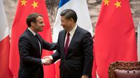 Emmanuel Macron et le président chinois Xi Jinping le 9 janvier 2018 à Pékin [Mark Schiefelbein / POOL/AFP]