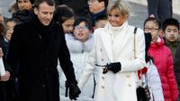 Brigitte et Emmanuel Macron lors de la visite de la Cité interdite, le 9 janvier 2017 à Pékin [CHARLES PLATIAU / POOL/AFP]