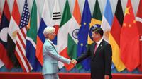 La directrice générale du Fonds Monétaire International (FMI) Christine Lagarde et le président chinois Xi Jinping, hôte du sommet du G20 organisé, à Hangzhou (est de la Chine), le 4 septembre 2016 [Greg BAKER / AFP]