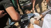 Le journaliste palestinien Yasser Mourtaja blessé par balles par l'armée israélienne le 6 avril 2018 près de la frontière entre la bande de Gaza et Israël dont la mort a été annoncée le 7 avril par le ministère de la Santé du Hamas [SAID KHATIB / AFP]