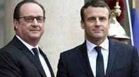 François Hollande (g) et son successeur à l'Elysée Emmanuel Macron, le 14 mai 2017 à Paris [STEPHANE DE SAKUTIN / AFP/Archives]