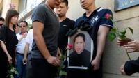 Des proches de Zhang Chaolin lors d'un rassemblement le 14 août 2016 à Aubervilliers à la mémoire de ce Chinois de 49 ans mort deux jours plus tôt des suites d'une agression [ALAIN JOCARD / AFP]
