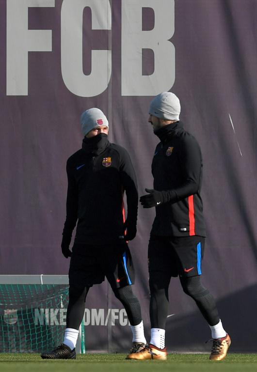 Lionel Messi et Luis Suarez durant une séance d'entraînement le 22 décembre 2017 près de Barcelone [LLUIS GENE / AFP]