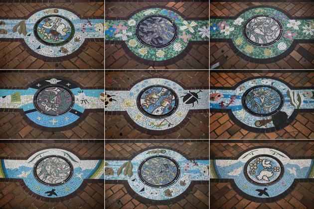 Montage de photos du 22 novembre 2017 de plaques d'égout décorées dans différentes villes du Japon [Behrouz MEHRI / AFP]