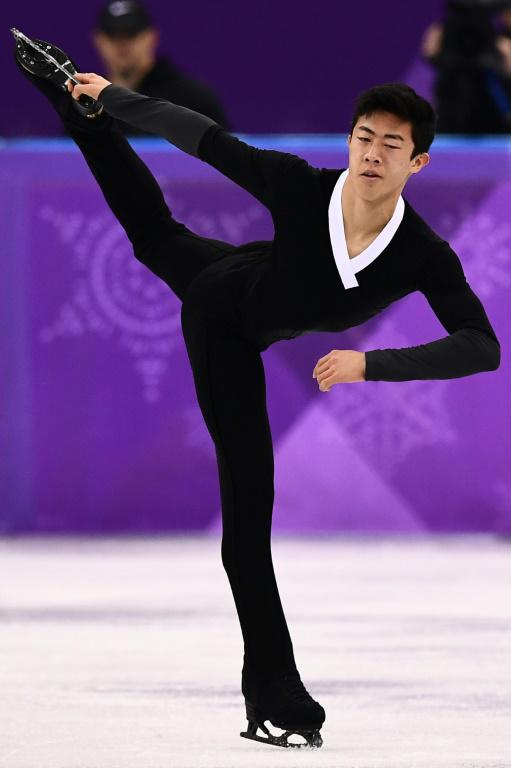 L'Américain Nathan Chen lors du programme libre messieurs de patinage artistique aux JO, le 17 février 2018 à La Tchèque Ester Ledecka lors du super-G aux JO, le 17 février 2018 à Pyeongchang  [ARIS MESSINIS / AFP/Archives]
