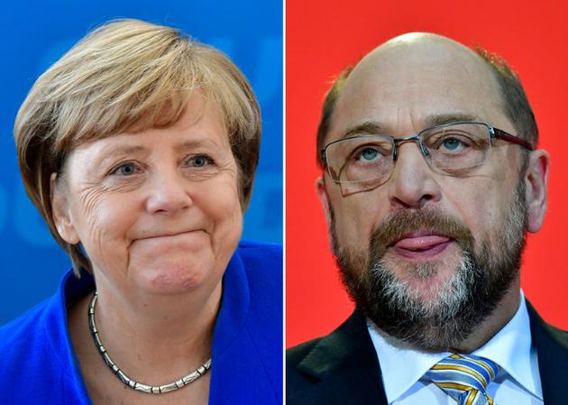 La chancelière allemande Angela Merkel et le dirigeant social-démocrate Martin Schulz [Tobias SCHWARZ / AFP/Archives]
