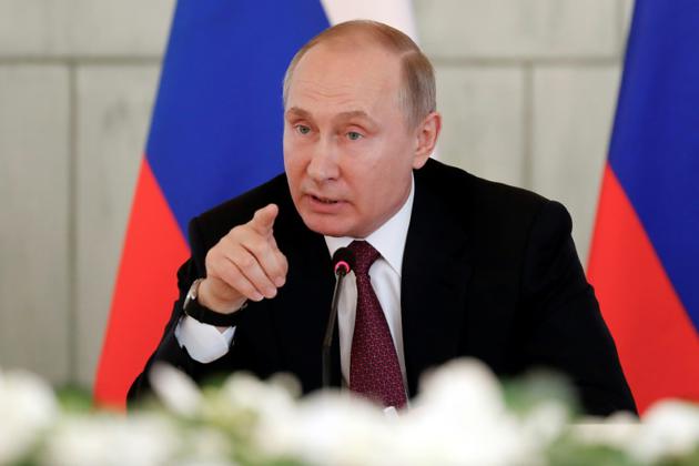 Le président russe Vladimir Poutine, le 16 mars 2018 à Saint-Pétersbourg  [Anatoly Maltsev / POOL/AFP]